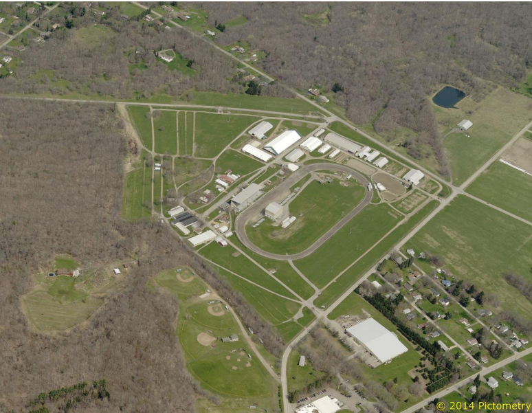 Aerial view of a large prison complex surrounded by roads and greenery.