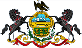 Coat of arms featuring a black eagle, horses, and a blue shield with gold accents.